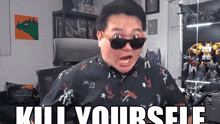 a man wearing sunglasses says kill yourself