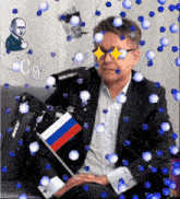 a man in a suit holds a small russian flag in front of him