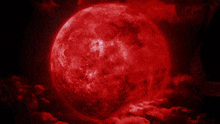 a red glowing object is surrounded by a dark background with a warning sign