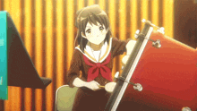 a girl in a school uniform is playing drums