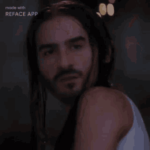 a man with long hair and a beard is being made with reface app