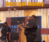 a man throwing money in the air with the words boss got money above him