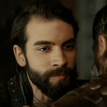 a man with a beard has his mouth open