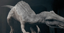 a statue of a dinosaur with a large mouth