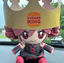 a stuffed animal with a crown on its head that says burger king