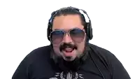 a man with a beard is wearing sunglasses and headphones