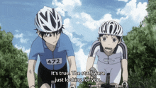 a man wearing a helmet has the number 472 on his jersey