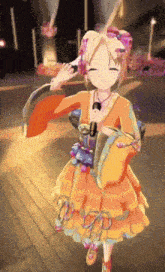 a girl in an orange dress is dancing on a wooden floor