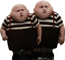 a couple of fat bald men standing next to each other on a white background .