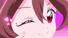 a close up of a girl 's face with hearts around her