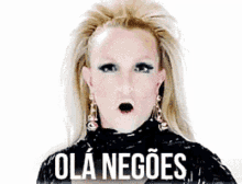 a blonde woman with a surprised look on her face is wearing a black top and earrings and says ola negoes