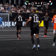 a soccer game is being played and the score is 3 to 4