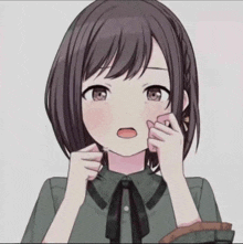 a close up of a girl with her mouth open