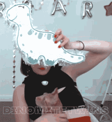 a picture of a girl with a dinosaur on her head and the word dinomite twins below her