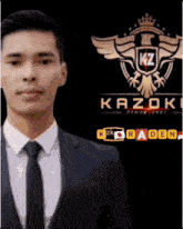 a man in a suit and tie stands in front of a logo for kazoku