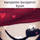 a picture of benjamin kyun with hearts surrounding him