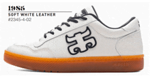 a pair of white sneakers with the year 1985 on it