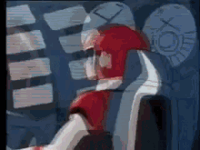 a man in a red and white suit is sitting in a chair in a room .