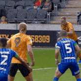 a soccer player with the number 5 on the back of his shirt