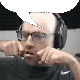 a bald man wearing glasses and headphones is making a funny face