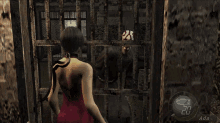 a woman in a red dress is holding a gun in front of a man with a mask on