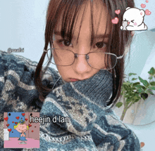 a girl wearing glasses and a sweater has the word heejin on the bottom right