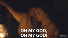 two women looking at a lantern with the words oh my god oh my god written on the bottom