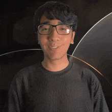 a man wearing glasses and a shirt that says emmett on it