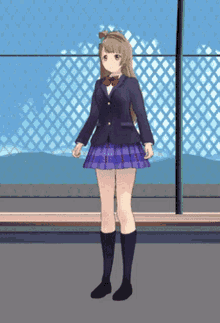 a girl in a school uniform stands in front of a chain link fence