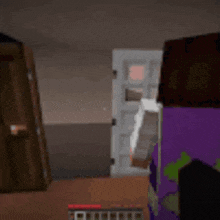 a person is playing a video game in a room with a window .