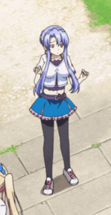 a girl with blue hair is standing on the sidewalk