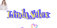 a woman is making a heart with her hands in front of a sign that says linda selex