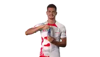 a man in a red bull shirt is holding a red bull can