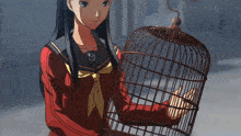 a girl in a school uniform holds a bird cage in her hands