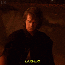 a man in a dark room says larper in yellow letters