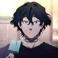 a man with black hair is holding an ice cream cone