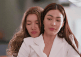 two women are hugging each other with a caption that says ' afternoon ' on the bottom right