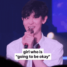 a young man is holding a microphone and says " girl who is " going to be okay "