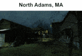 a picture of north adams ma with a few buildings and trees