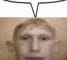 a blurry picture of a man 's face with a white speech bubble above it .
