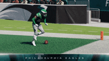a player for the philadelphia eagles kicks the ball