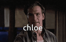 a close up of a man 's face with the word chloe on it