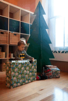 kids baby opening presents christmas morning