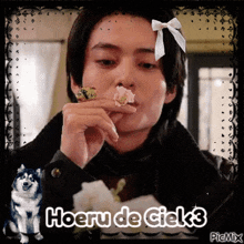 a picture of a man with a bow on his head and the words hoeru de ciek3 on the bottom