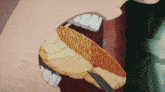 a person is eating a piece of bread with a fork in their mouth