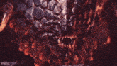 a dragon is flying through the air in a dark room surrounded by fire .