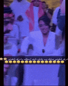 a woman in a white shirt is smiling in a crowd