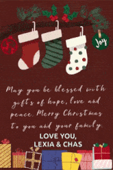 a christmas card with stockings and gifts and the words may you be blessed with gifts of hope love and peace