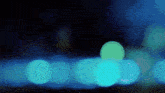 a blurry picture of a row of blue lights in the dark