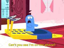 a cartoon character says " can 't you see i 'm on the phone " in yellow letters